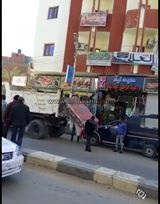 بالصور.. تنفيذ قرارات إزالة ومخالفات ضمن مبادرة "إعادة الانضباط لشارع" بالخارجة