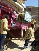 بالصور.. تنفيذ قرارات إزالة ومخالفات ضمن مبادرة "إعادة الانضباط لشارع" بالخارجة