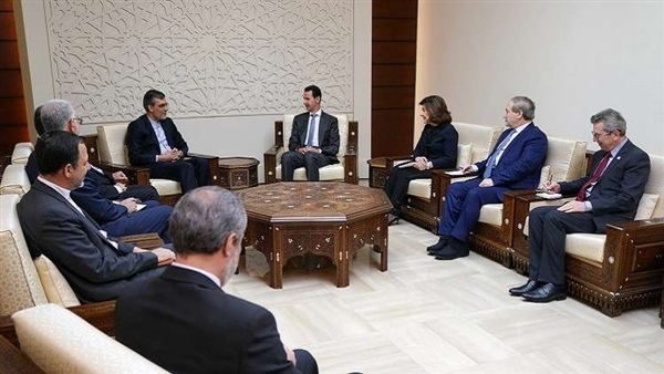 الأسد ومسؤول إيراني